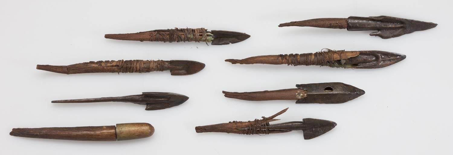 Selection of different shaped arrow heads laid in rows