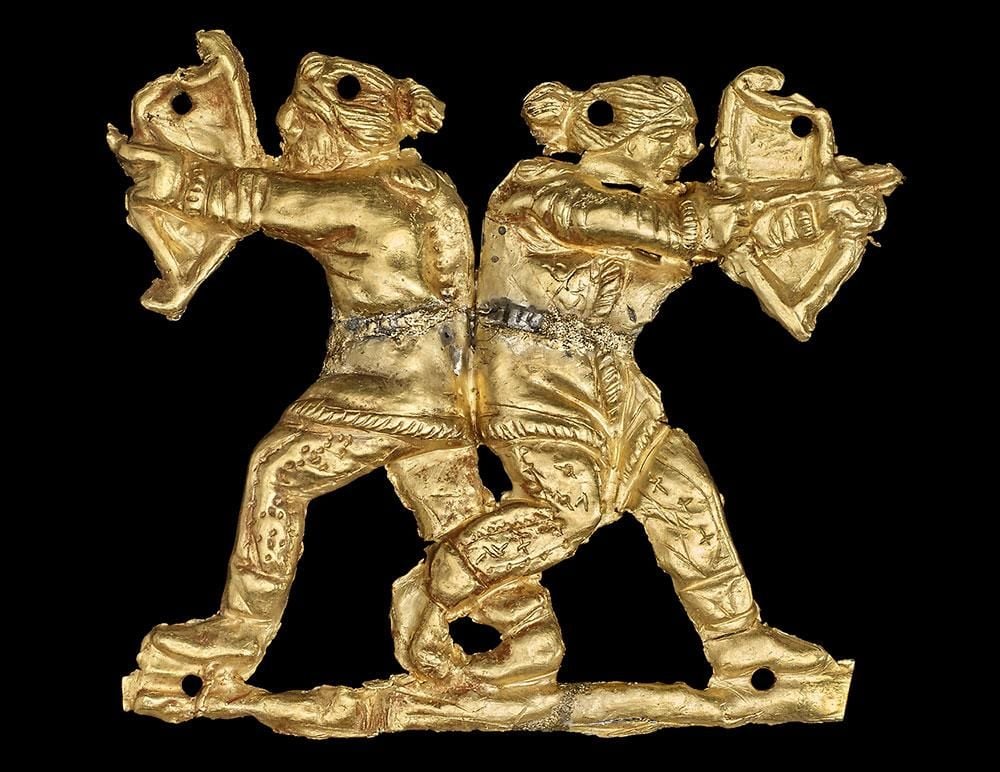 Gold sew-on clothing appliqué in the form of two Scythian archers back to back